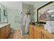 Charming bathroom with decorative wallpaper, double vanity and walk-in shower at 11190 Hembree Springs Dr, Roswell, GA 30076