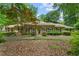 Charming brick ranch-style home featuring a beautifully landscaped front yard and inviting curb appeal at 11190 Hembree Springs Dr, Roswell, GA 30076