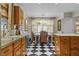 Bright kitchen featuring wood cabinets, stainless steel appliances, tile backsplash, and a dining area at 11190 Hembree Springs Dr, Roswell, GA 30076