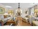 Living room featuring hardwood floors, ornate decor, and elegant furniture arrangement at 11190 Hembree Springs Dr, Roswell, GA 30076
