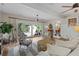 Open living room with sliding doors to the backyard, ceiling fans, and modern decor at 11190 Hembree Springs Dr, Roswell, GA 30076