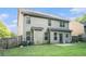 The backyard has a grassy lawn, privacy fence, and a small patio area at 3300 Allison Cir, Decatur, GA 30034
