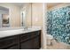 Bathroom featuring a patterned shower curtain, vanity, sink, and toilet at 3300 Allison Cir, Decatur, GA 30034