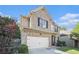 Two-story brick home with a two-car garage and fresh landscaping at 3300 Allison Cir, Decatur, GA 30034