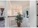 Hallway featuring a wrought iron railing and view into adjacent bedrooms at 3300 Allison Cir, Decatur, GA 30034