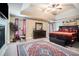 Main bedroom features a tray ceiling, ceiling fan, fireplace and stylish furnishings at 3300 Allison Cir, Decatur, GA 30034