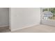 Well-lit bedroom showing large window with neighborhood views and neutral carpet at 3941 Fairhaven Rd, Lithia Springs, GA 30122