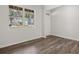 Well-lit bedroom with natural light, wood floors, and neutral walls at 3941 Fairhaven Rd, Lithia Springs, GA 30122