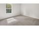 Bedroom with cozy carpeting, natural light, and neutral color palette at 3941 Fairhaven Rd, Lithia Springs, GA 30122