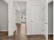 Inviting entryway with hardwood floors and white doors leading to the living spaces in the home at 3941 Fairhaven Rd, Lithia Springs, GA 30122