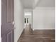 View of the entryway featuring hardwood floors, white trim, and high ceilings leading to the backyard at 3941 Fairhaven Rd, Lithia Springs, GA 30122