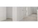 Light and bright neutral-colored hallway with carpet at 3941 Fairhaven Rd, Lithia Springs, GA 30122