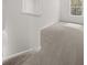 Carpeted hallway next to stairs, all in light neutral colors at 3941 Fairhaven Rd, Lithia Springs, GA 30122