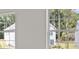 These windows offer views of nearby homes and dense trees at 3941 Fairhaven Rd, Lithia Springs, GA 30122