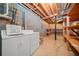 Unfinished basement with laundry area, exposed ceilings, and room for storage at 3 Maplelake Dr, Acworth, GA 30101