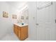Bathroom features wood cabinets, a modern mirror, and white countertops at 3 Maplelake Dr, Acworth, GA 30101