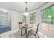 Bright kitchen nook featuring a table with seating for two and a picturesque view of the backyard at 3 Maplelake Dr, Acworth, GA 30101