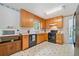 Well-equipped kitchen with black appliances, ample cabinetry, and bright countertops at 3 Maplelake Dr, Acworth, GA 30101