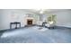 Spacious living room featuring a brick fireplace and large windows, inviting natural light at 3 Maplelake Dr, Acworth, GA 30101
