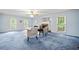 Living room featuring a fireplace, seating, ceiling fan, and large windows at 3 Maplelake Dr, Acworth, GA 30101