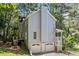Two story home featuring two garage doors beneath a cozy side porch at 3 Maplelake Dr, Acworth, GA 30101