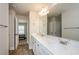 Bathroom featuring double vanity with plenty of counter space and views into adjacent bedroom at 3405 Linstead Ct, Loganville, GA 30052