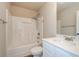 Bathroom with combination shower/tub, bright countertops, and all white finishes at 3405 Linstead Ct, Loganville, GA 30052