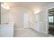 The ensuite bathroom features dual sinks, white cabinets and tile floors at 3405 Linstead Ct, Loganville, GA 30052