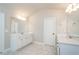 Bright bathroom has double vanity with lots of cabinets and large mirror at 3405 Linstead Ct, Loganville, GA 30052