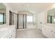 Spacious bathroom with separate vanities, shower and soaking tub at 3405 Linstead Ct, Loganville, GA 30052