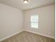 Cozy bedroom with neutral carpet, window and fresh paint at 3405 Linstead Ct, Loganville, GA 30052