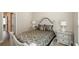 Cozy bedroom featuring a decorative headboard, stylish bedding, and neutral color palette at 3405 Linstead Ct, Loganville, GA 30052