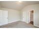 Bedroom with entrances to other areas of the home and featuring neutral walls and plush carpet at 3405 Linstead Ct, Loganville, GA 30052