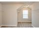Walk-in closet features neutral walls, carpet floors, shelving and natural light at 3405 Linstead Ct, Loganville, GA 30052