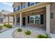 Inviting front porch with brick columns, stone walkway, and well-maintained landscaping enhances curb appeal at 3405 Linstead Ct, Loganville, GA 30052