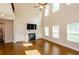 Bright and airy living room with built-in shelves, fireplace, and large windows at 3405 Linstead Ct, Loganville, GA 30052