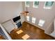 Bright living room features a fireplace, built-in bookshelves, gleaming hardwood floors and plenty of natural light at 3405 Linstead Ct, Loganville, GA 30052