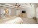 This primary bedroom includes a tray ceiling, neutral walls and plush carpet floors at 3405 Linstead Ct, Loganville, GA 30052