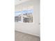 Bright bedroom with large window and a view of the other homes in the area at 3933 Fairhaven Rd, Lithia Springs, GA 30122