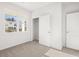 Bedroom featuring plush carpeting, closet, and two doors at 3933 Fairhaven Rd, Lithia Springs, GA 30122