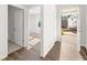 Inviting entryway with wood floors, leading into a bright, new construction home at 3933 Fairhaven Rd, Lithia Springs, GA 30122