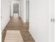 Bright hallway with hardwood floors leading to various rooms in the home at 3933 Fairhaven Rd, Lithia Springs, GA 30122