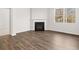 Cozy living room with fireplace and large windows offering natural light at 3933 Fairhaven Rd, Lithia Springs, GA 30122