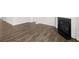 A cozy living room with new laminate flooring and modern fireplace insert at 3933 Fairhaven Rd, Lithia Springs, GA 30122