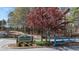Deer Lick Park entrance with stone sign, a blue gate and a white fence at 3933 Fairhaven Rd, Lithia Springs, GA 30122