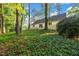 Exterior view of the home's backyard with mature trees at 4274 Smithsonia Ct, Tucker, GA 30084
