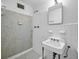 Clean bathroom with tiled shower, vanity, mirror, and ample lighting at 4274 Smithsonia Ct, Tucker, GA 30084