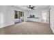 Bedroom featuring neutral carpet, a ceiling fan, and sliding glass doors to a patio at 4274 Smithsonia Ct, Tucker, GA 30084
