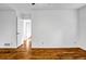 Empty bedroom with wooden floors and neutral walls, showcasing ample natural light at 4274 Smithsonia Ct, Tucker, GA 30084