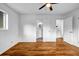 Bedroom with hardwood floors, a ceiling fan, and an ensuite bathroom, and ample closet space at 4274 Smithsonia Ct, Tucker, GA 30084